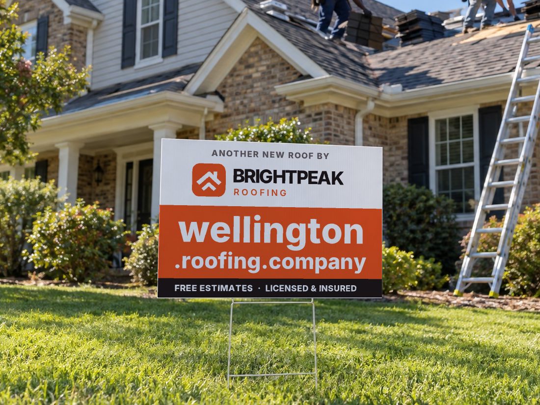 wellington.roofing.company on a yard sign in front of a house getting a new roof
